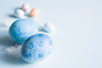 Blue Easter eggs on blue background, soft focus 