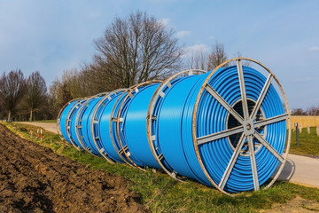 Large cable drums with industrial cables with blue jacket