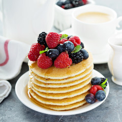 Stack of buttermilk pancakes with fresh berries