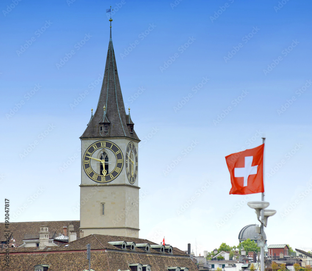 Canvas Prints clock tower of the st. peter church and swiss flag on the facade building in zurich, switzerland