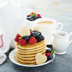 Stack of buttermilk pancakes with fresh berries