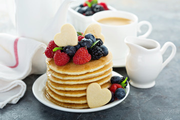 Stack of buttermilk pancakes with fresh berries