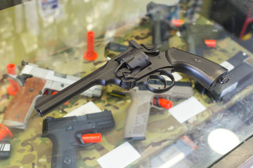  pistol on the glass table in army shop