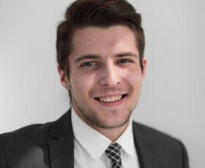 closeup.the face of a successful young man