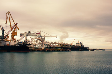 Cargo cranes in the dock of the industrial port.Spain, Cadiz, February 2018.