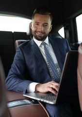 Business people use a laptop