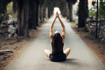 Carefree calm woman meditating in nature.Finding inner peace.Yoga practice.Spiritual healing...