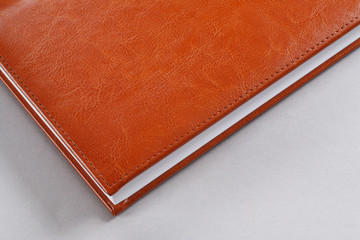 Red diary of genuine leather close-up