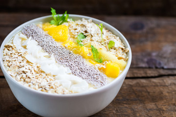 Mango, Banana, Pineapple and Oatmeal Smoothie in the Bowl