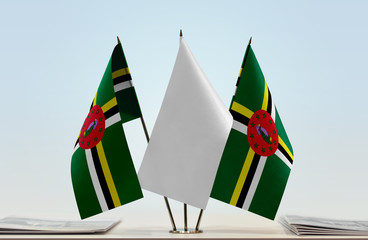Two flags of Dominica with a white flag in the middle