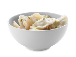 Bowl with tasty dumplings on white background