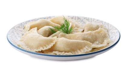 Plate with tasty dumplings on white background