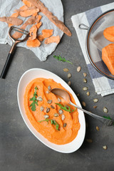 Plate with tasty mashed sweet potato on table