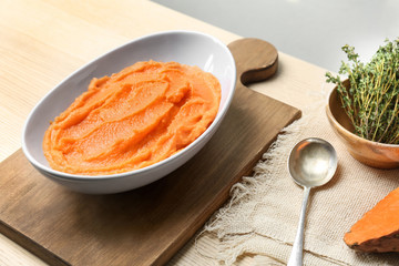 Bowl with tasty mashed sweet potato on table