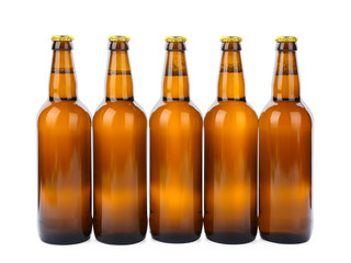 Glass bottles of beer isolated on white