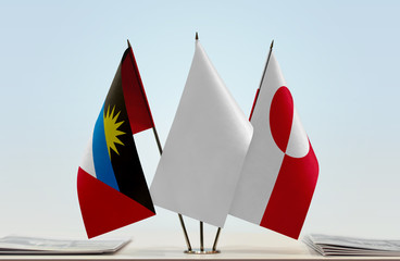 Flags of Antigua and Barbuda and Greenland with a white flag in the middle