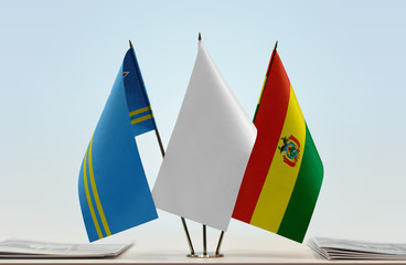 Flags of Aruba and Bolivia with a white flag in the middle