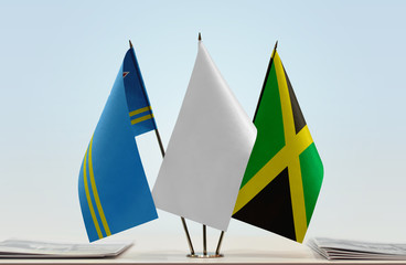 Flags of Aruba and Jamaica with a white flag in the middle