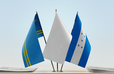 Flags of Aruba and Honduras with a white flag in the middle