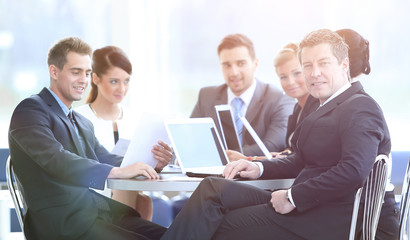 Fototapeta premium businessman and his business team with financial documents sitti