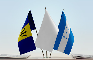 Flags of Barbados and Honduras with a white flag in the middle
