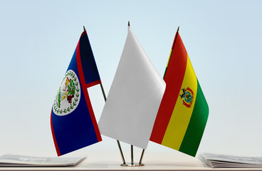 Flags of Belize and Bolivia with a white flag in the middle