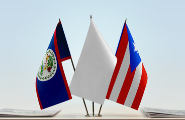 Flags of Belize and Puerto Rico with a white flag in the middle