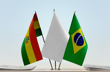 Flags of Bolivia and Brazil with a white flag in the middle