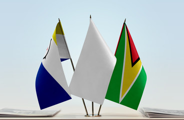 Flags of Bonaire and Guyana with a white flag in the middle