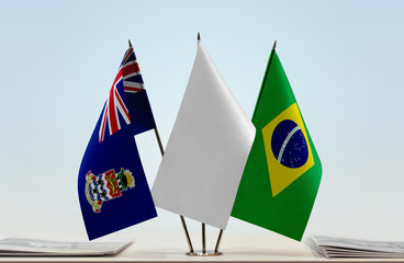 Flags of Cayman Islands and Brazil with a white flag in the middle
