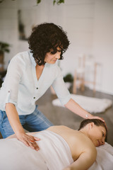 woman on a massage table with masseuse