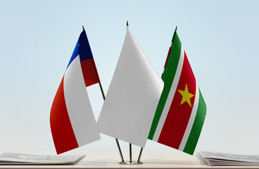 Flags of Chile and Suriname with a white flag in the middle