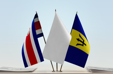 Flags of Costa Rica and Barbados with a white flag in the middle