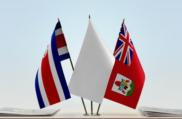 Flags of Costa Rica and Bermuda with a white flag in the middle