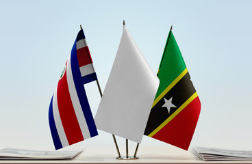 Flags of Costa Rica and Saint Kitts and Nevis with a white flag in the middle