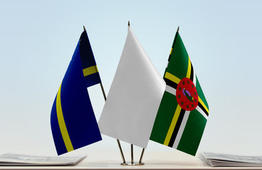 Flags of Curacao and Dominica with a white flag in the middle