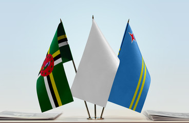 Flags of Dominica and Aruba with a white flag in the middle