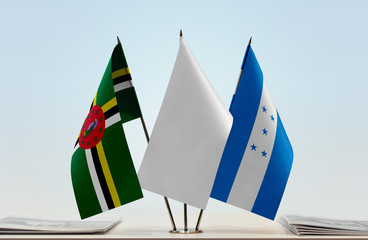 Flags of Dominica and Honduras with a white flag in the middle