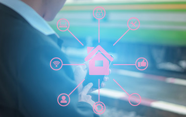 Internet of things (IoT) concept. businessman against night cityscape working with social connection media concept.