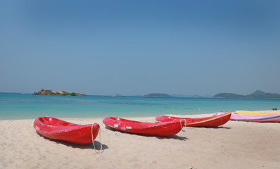canoes on the beach with beautiful sky