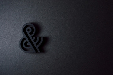 black ampersand with parallel lines on black background - 193068270