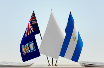 Flags of Falkland Islands and Nicaragua with a white flag in the middle