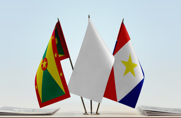 Flags of Grenada and Saba with a white flag in the middle