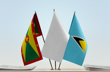 Flags of Grenada and Saint Lucia with a white flag in the middle