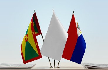 Flags of Grenada and Sint Maarten with a white flag in the middle