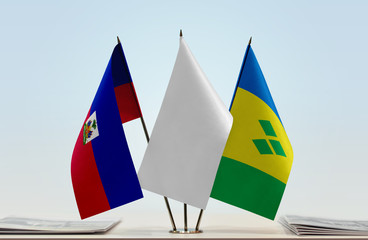 Flags of Haiti and Saint Vincent and the Grenadines with a white flag in the middle