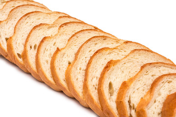 Sliced loaf of wheat bread on white background