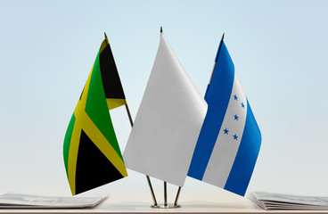 Flags of Jamaica and Honduras with a white flag in the middle