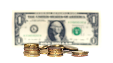Coins and dollar on white background