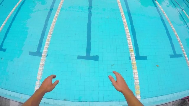 First Person View: Swimmer Jumping in Big Swimming Pool. HD Underwater POV Gopro. Bali, Indonesia.